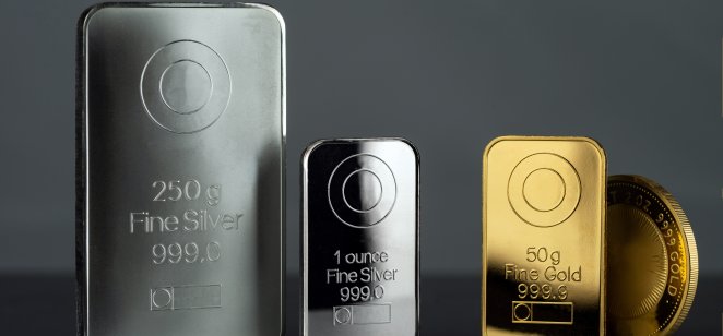 A row of gold and silver bars along with a coin