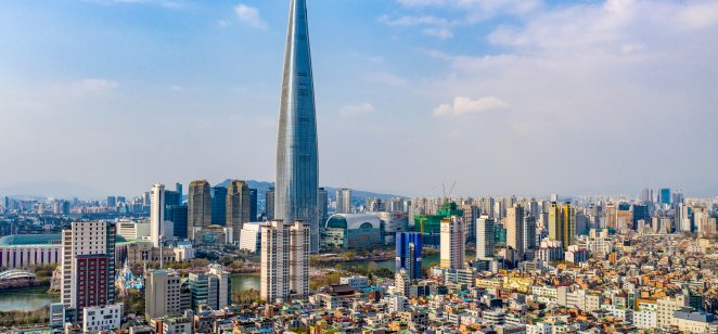 Jamsil, Songpa-gu, Seoul, South Korea - April 11, 2020: Aerial view of Lotte World Tower surrounded by houses and highrise apartments