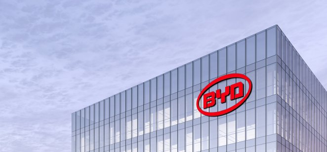 BYD stock forecast: Will Chinese EV maker recover? YD Auto Signage Logo on Top of Glass Building. Workplace Car Company Office Headquarter.