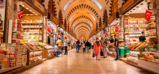 People shopping and walking throught the famous ancient bazaar, the Egyptian Bazaar or Misir Carsisi in Istanbul.