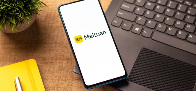 Meituan logo on phone screen stock image.