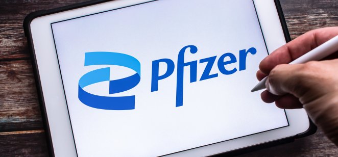 Kumamoto, JAPAN - Jul 27 2021 : Logo of US multinational pharmaceutical and biotechnology corporation Pfizer Inc. headquartered on 42nd St. in Manhattan NYC, on tablet. Man hand holding wireless pen.