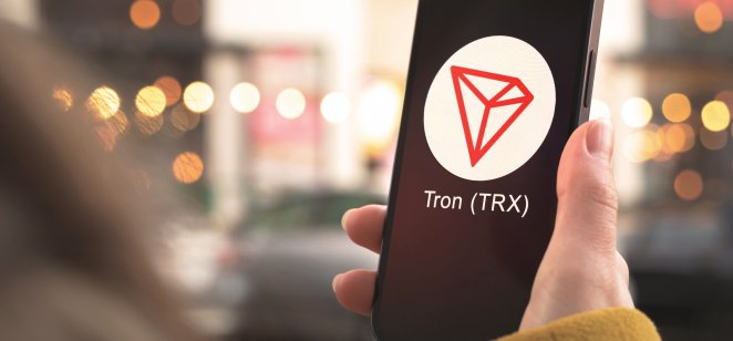 TRON A Tron emblem on a smratphone