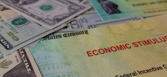 US economic stimulus Stimulus package financial package government for people, US dollar cash banknote on American flag