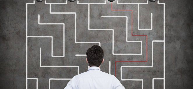 Exit trading strategies: When to exit your trade Confused businessman brainstorming the labyrinth to find the solution