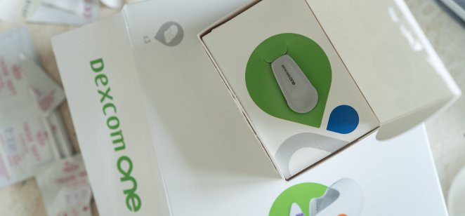 Dexcom one product box, Dexcom logo