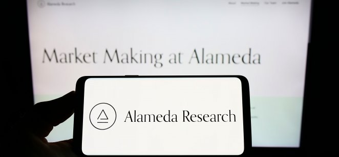 Alameda Research logo on smartphone and computer screen 