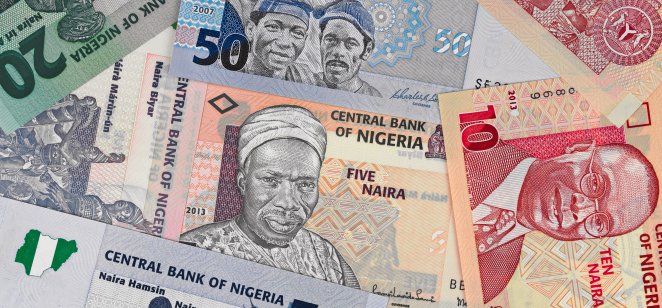 Nigeria money, heap of various naira banknotes, African nigerian currency
