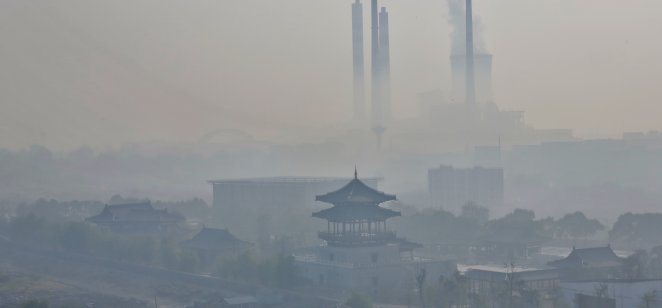 Fog and haze from a coal power plant shrouds Jiujiang City in China