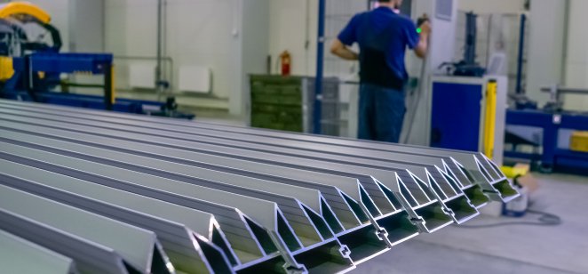 Row of aluminium profiles for construction in a factory