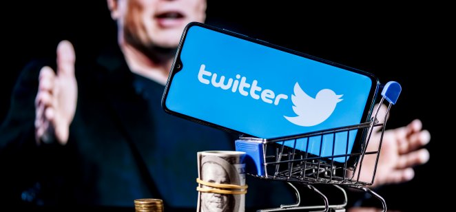 Elon Musk latest threat sends Twitter stock down 7.63% Elon Musk with shopping cart with Twitter on a cell phone