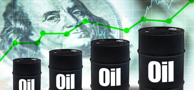 Oil barrels in front of dollars