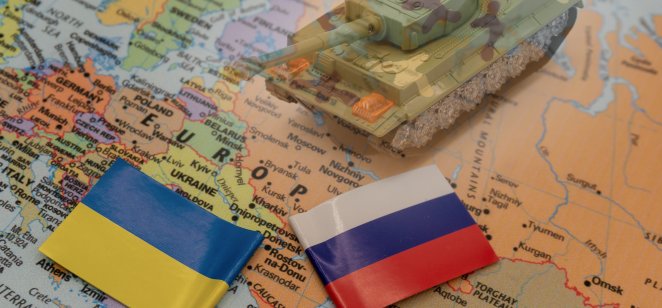 Russia and Ukraine with toy tank and flags