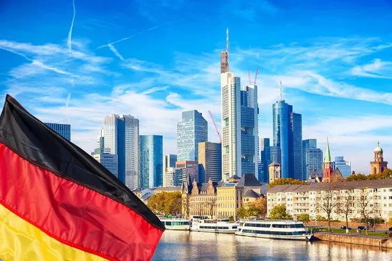 Frankfurt skyline with modern financial district skyscrapers and German flag, representing the Germany 40 (DAX) index