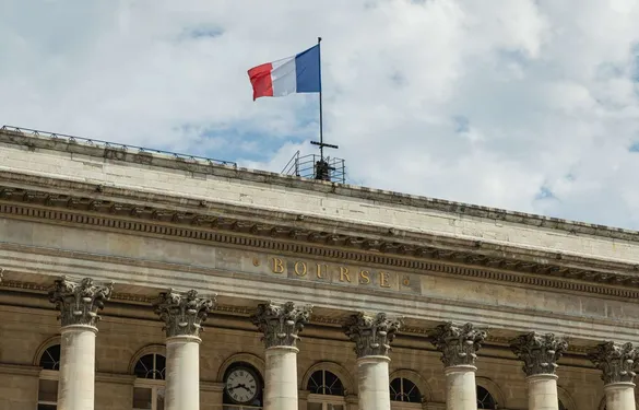 Stock exchange building, with the French flag above the facade