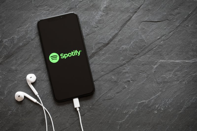 spotify stock split Spotify logo on the screen.