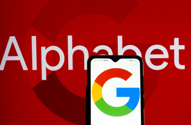 Alphabet shareholders In this photo illustration Alphabet Inc. and Google logos seen displayed on a smartphone