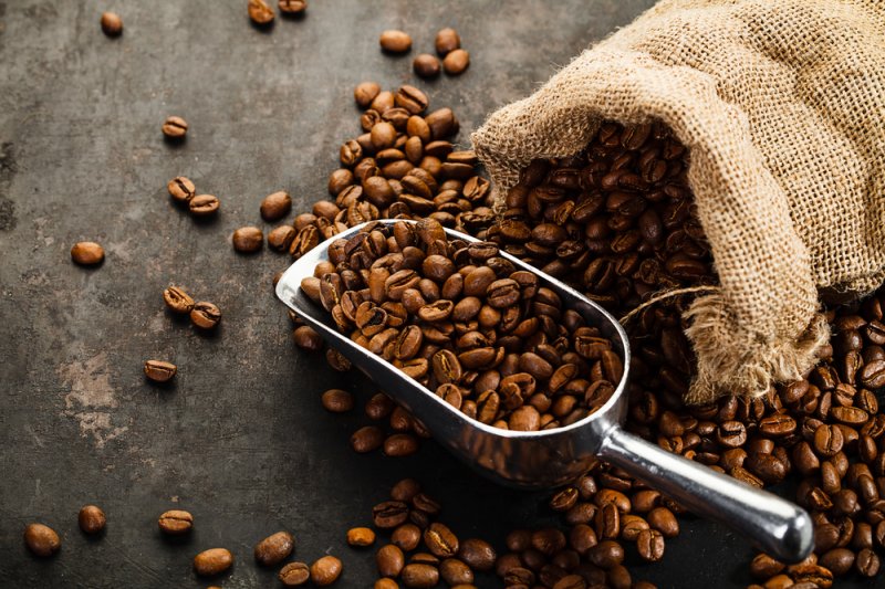 Coffee beans Coffee beans falling out of bag with scoop