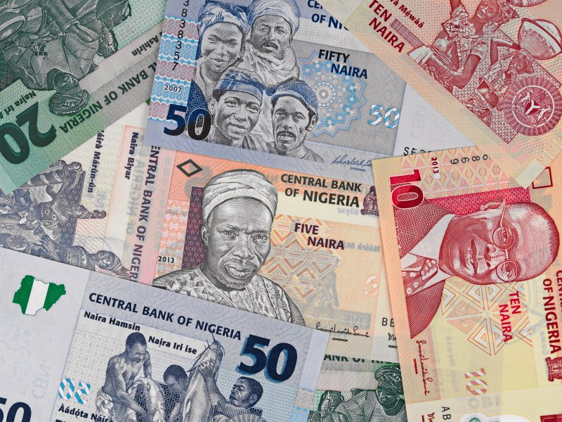 Nigerian naira forecast Nigeria money, heap of various naira banknotes, African nigerian currency
