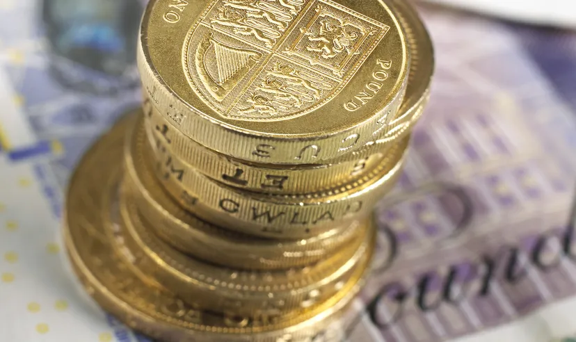 British banknotes and coins photographed directly above