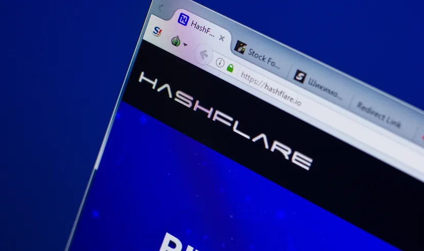 The HashFlare website URL is displayed on a computer screen