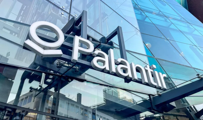 Palantir Technologies logo displayed on the glass facade of a modern office building Palantir Technologies logo displayed on the glass facade of a modern office building