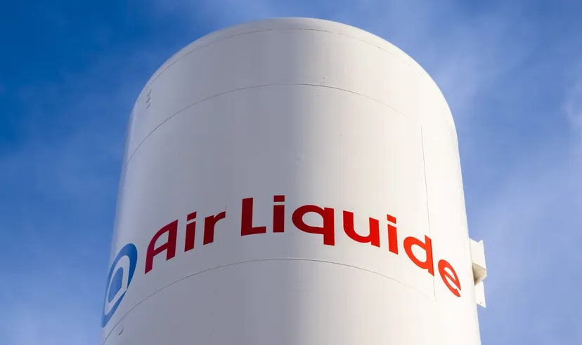 Air Liquide logo displayed on an industrial storage tank against a blue sky Air Liquide logo displayed on an industrial storage tank against a blue sky