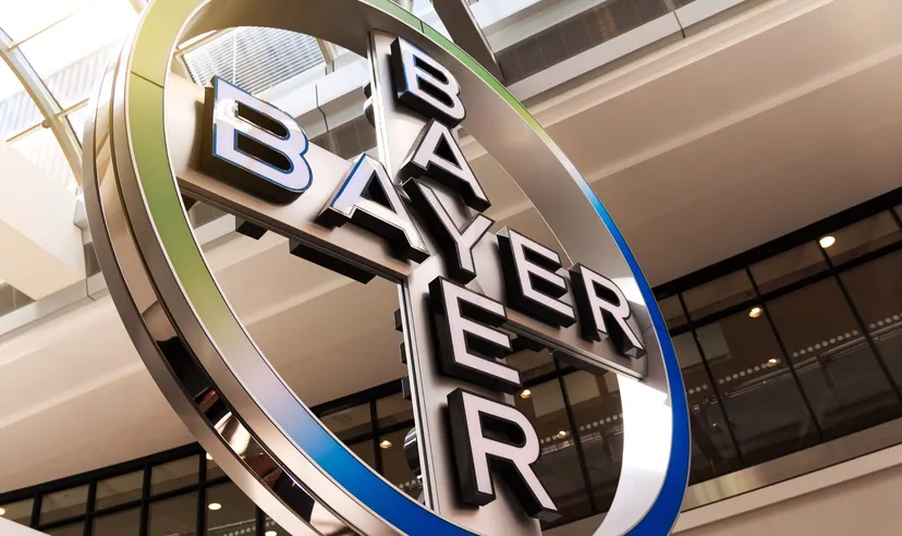 Large Bayer logo sign displayed inside a modern corporate building Large Bayer logo sign displayed inside a modern corporate building