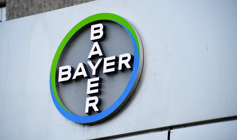 Bayer logo displayed on the exterior wall of a building with a circular blue and green design