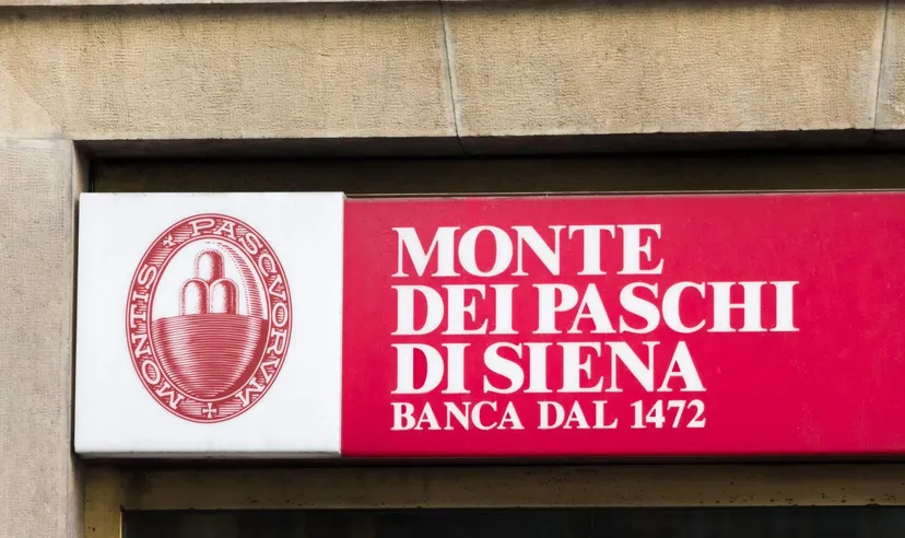Monte dei Paschi di Siena bank logo displayed on a red sign on a building facade