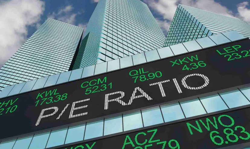 Electronic stock market ticker displaying financial quotes in front of modern skyscrapers, representing global financial markets, trading activity, and investment performance. 