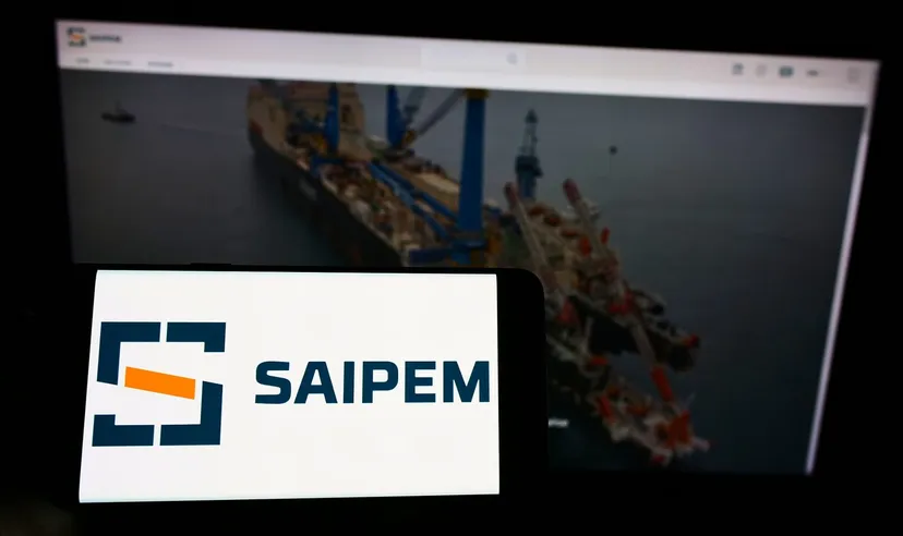 Saipem logo on a mobile device with offshore oil and gas infrastructure, representing the engineering and energy services company