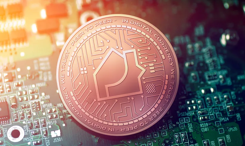 Propy price prediction: Will the real estate NFT soar high?  shiny copper PROPY cryptocurrency coin on blurry motherboard background
