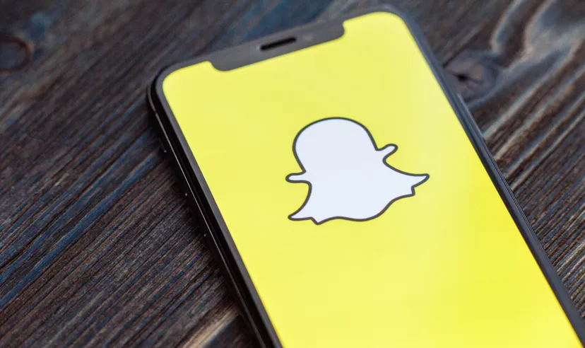 Snap stock forecastdia app for smartphones. Snap logo on a smartphone screen