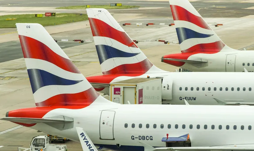 British Airways aircraft tails at an airport gate