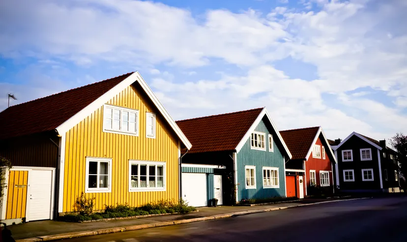 Picture of a swedish street with small multi coloured houses during spring  