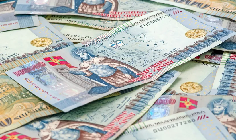 Armenian Dram Forecast Close-up of Armenian Dram in AMD 100,000 banknotes. Business and finance concept. Macro composition with selective focus and blurred background