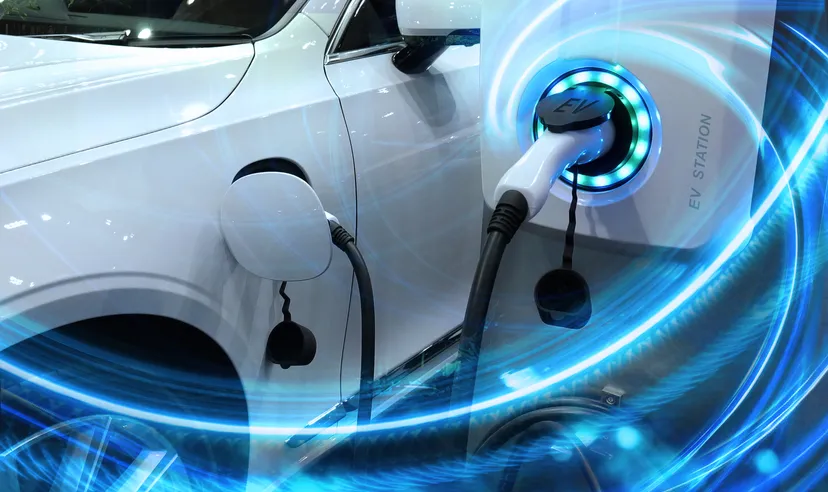 Ideanomics (IDEX) Electric vehicle at charging station with the power cable supply plugged in owith