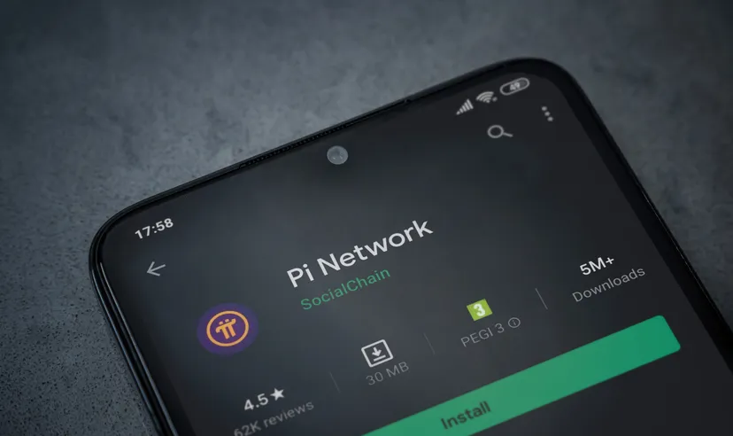 Pi Network app play store page on the display of a black mobile smartphone on dark marble stone background. Top view flat lay with copy space.