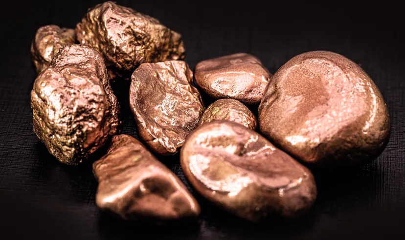 native copper nuggets isolated on black background, ore for industrial use in electrical wires and household utensils