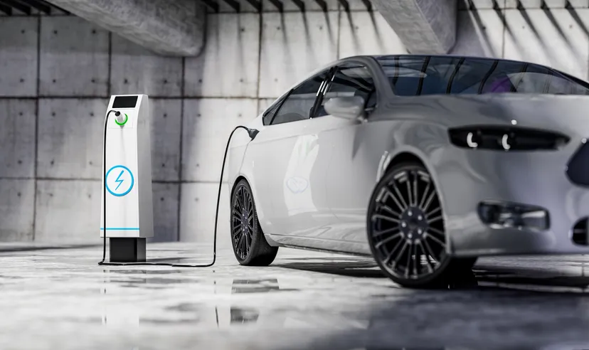 Charging an electric car with a public charger in a parking lot sustainable climate visuals 