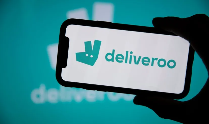 LONDON, UK - April 2021: Deliveroo takeaway delivery service logo on a phone