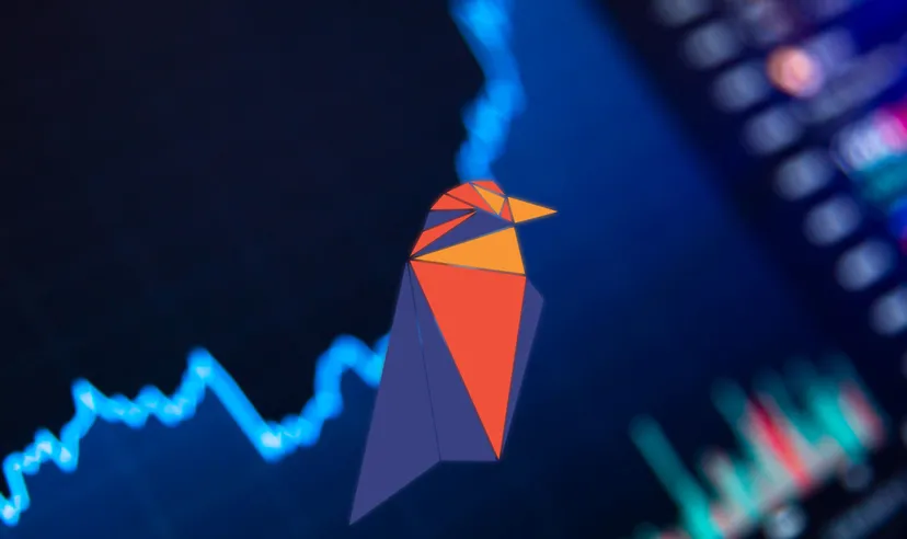 Ravencoin (RVN) logo, showing graphic of a colourful bird against a darkened financial graph