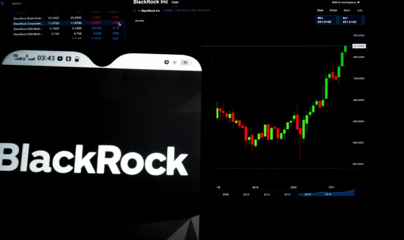 BlackRock Inc. logo displayed on a smartphone with the stock chart of BlackRock Inc. in the background.