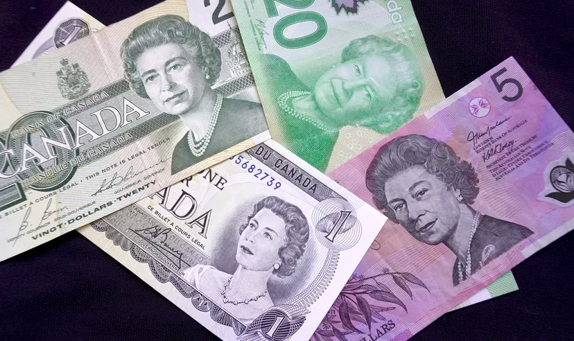 Canadian and Australian currency with portraits of Queen Elizabeth II