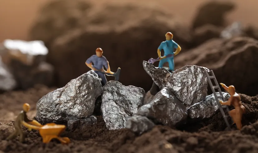 Lithium price forecast: Rising EV demand to cause new highs? Mining of Tantalum, Nickel, Cobalt, lithium. Miniature worker mining metal Tantalum and silver. Mining business, Mineral Resources.