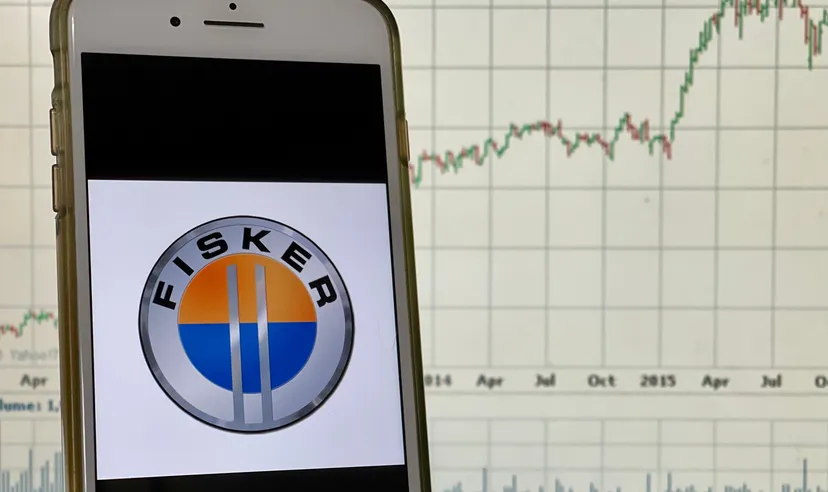 Spokane, WA - August 2021 - Fisker logo on a smart phone with stock chart in the background. Fisker is an American electric vehicle automaker