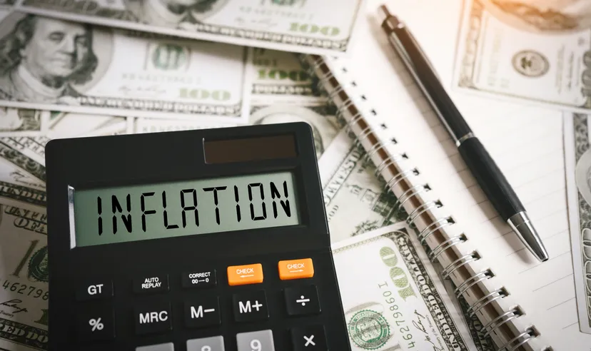 US inflation rate INFLATION word on calculator in idea for FED consider interest rate hike