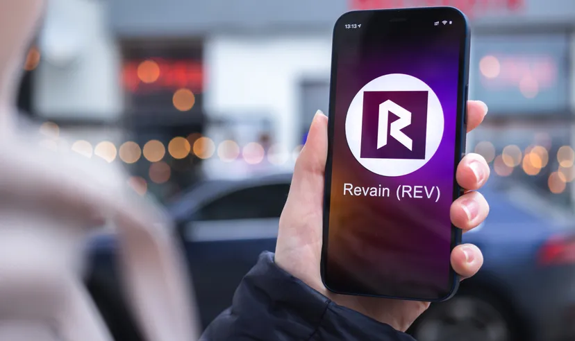 Revain Revain (REV) logo on a smartphone screen