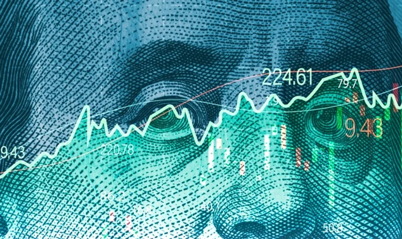 Closeup Benjamin Franklin face on USD banknote with stock market chart graph for currency exchange and global trade forex concept.